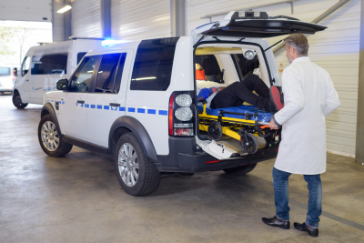 paramedics offloading patient from an ambulance