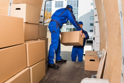 Two professional workers passing the box